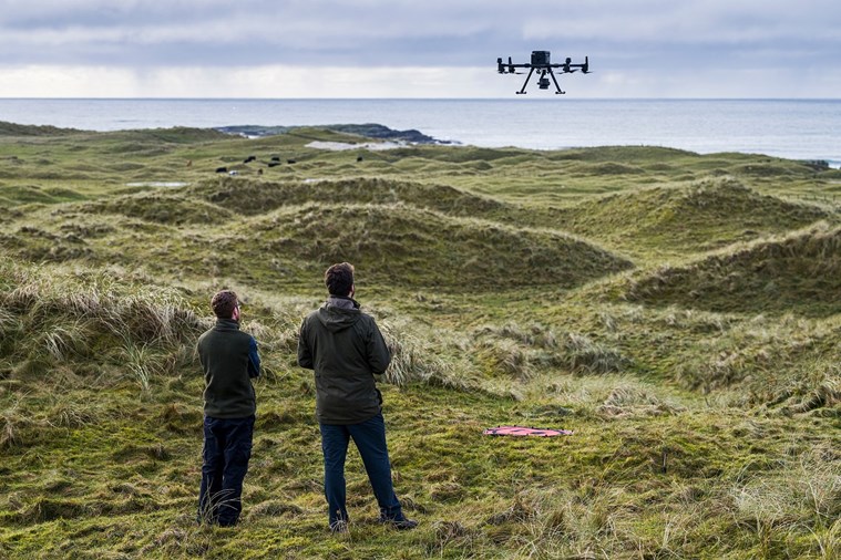 environmental specialists use a drone to estimate carbon storage on Tiree, Scotland